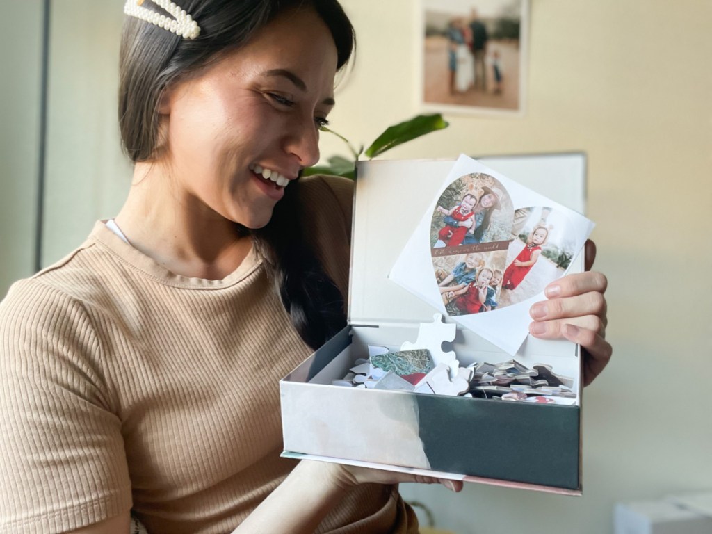 woman holding minted gift box with custom photo personalized puzzle