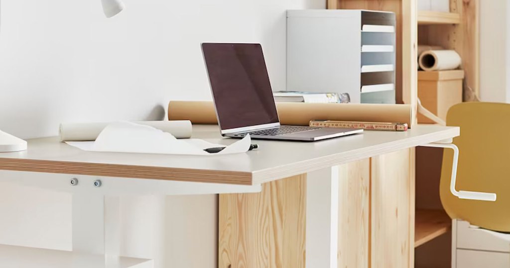desk with laptop on it