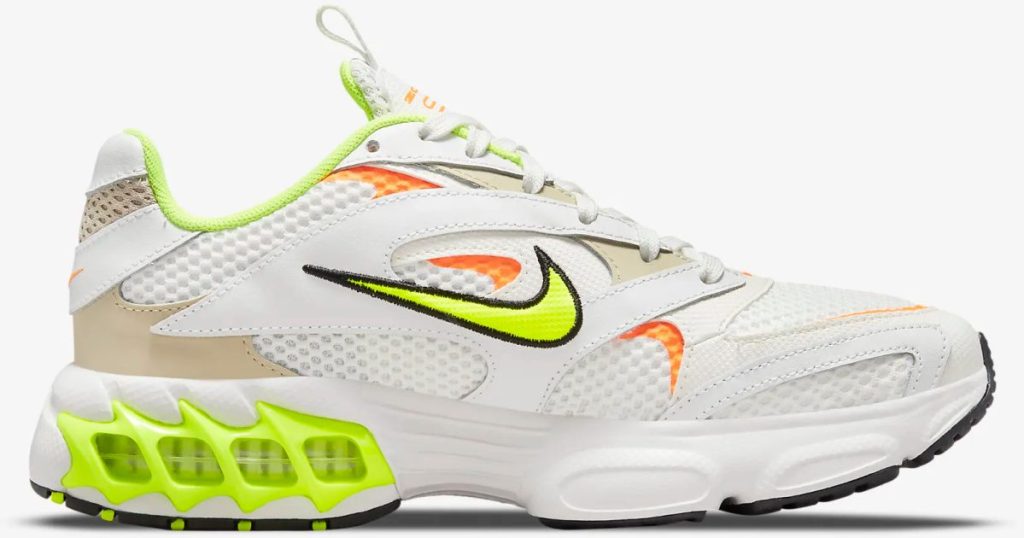 white, neon yellow, and orange sneaker
