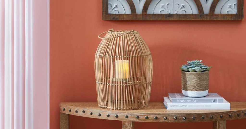 rattan lantern candle holder on entryway table