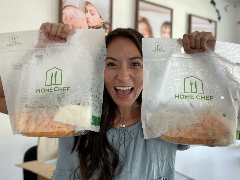 woman holding two Home Chef meal bags