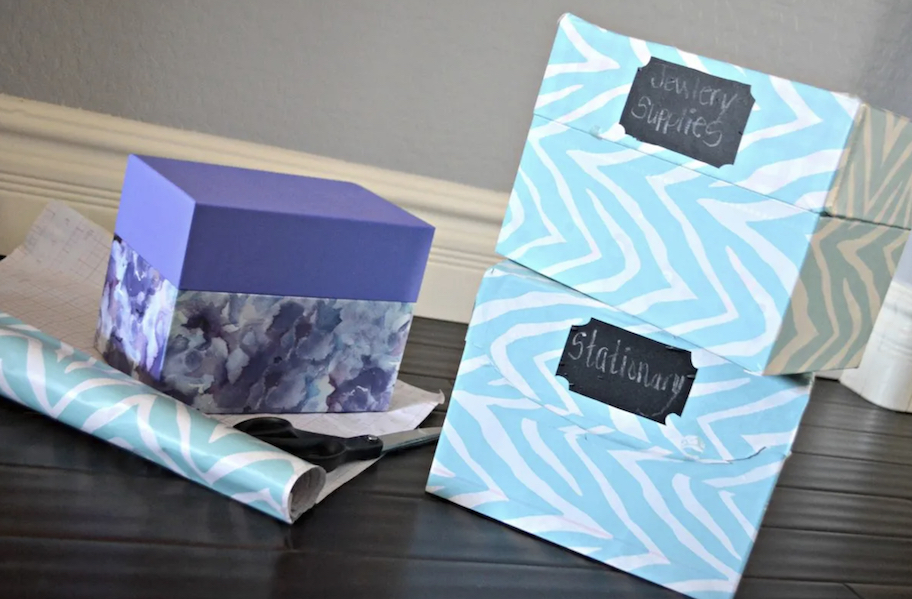 shoe boxes on table with wrapping paper