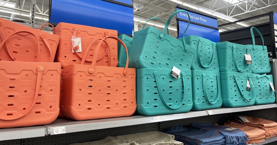 orange and teal tote bags on store shelf