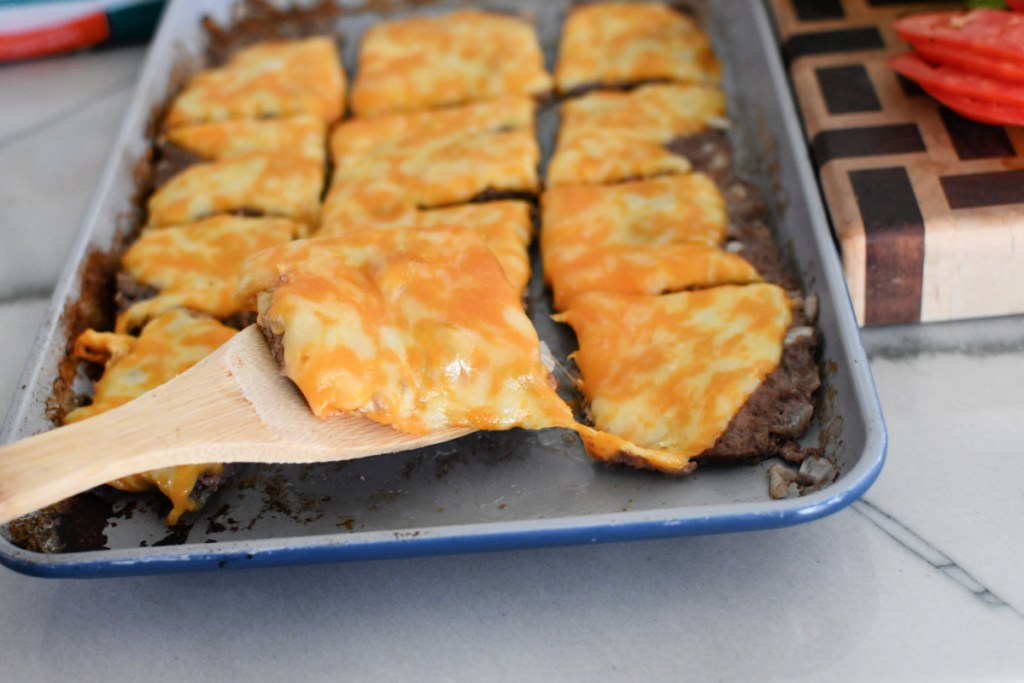 sheet pan with 12 beef cheeseburgers