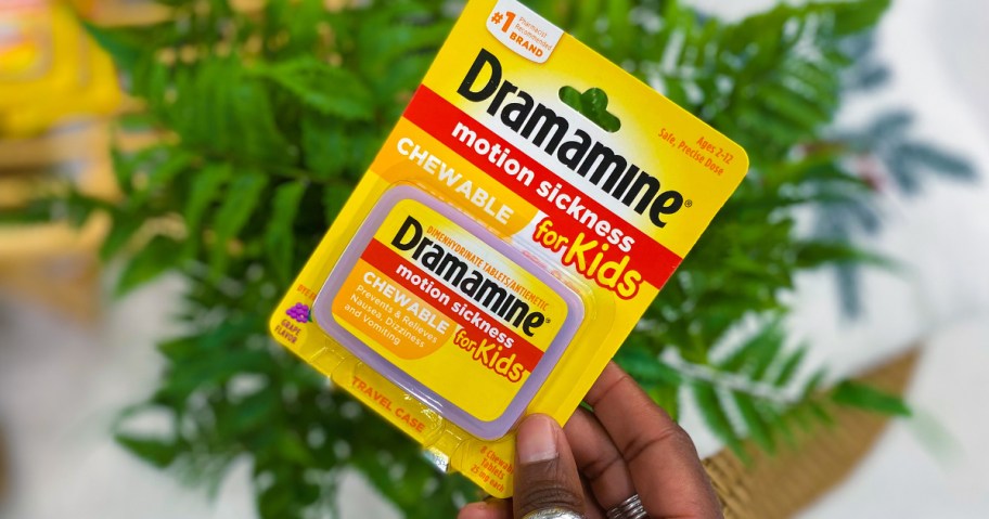 Hand holding kids dramamine