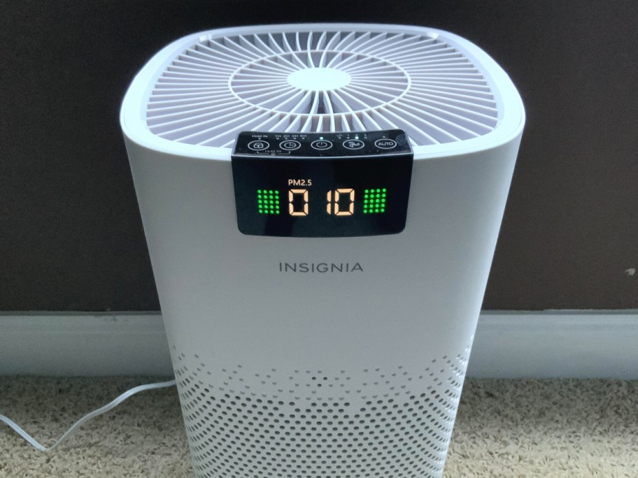 Insignia 375 Sq. Ft. HEPA Air Purifier upclose displaying the time on it 