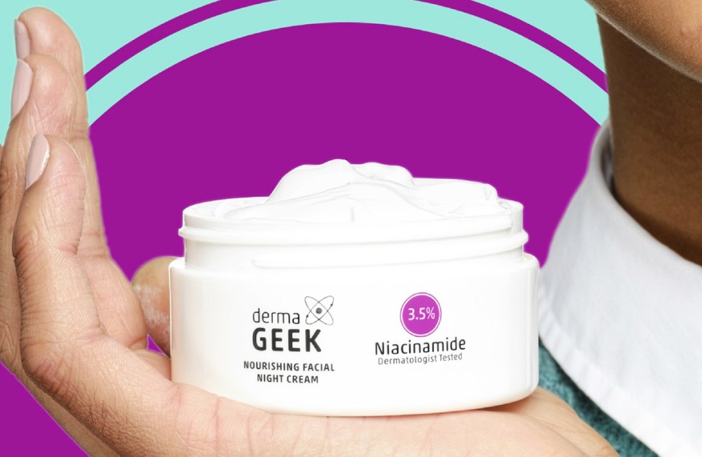 hand holding jar of dermaGEEK Nourishing Facial Night Cream