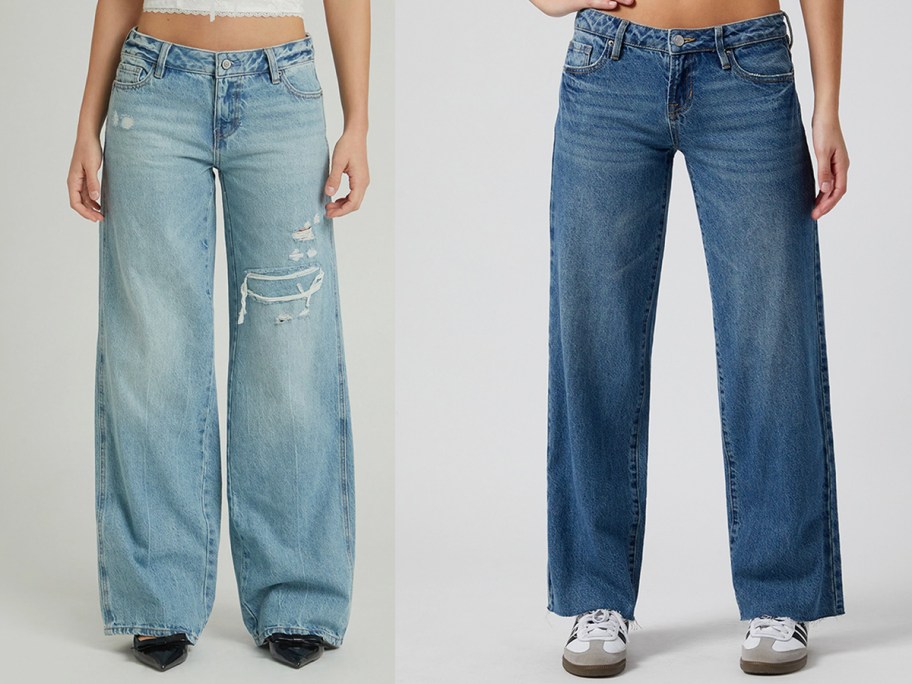 two women wearing blue jeans 
