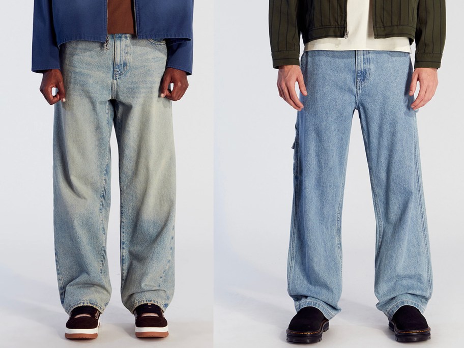 two men wearing blue jeans