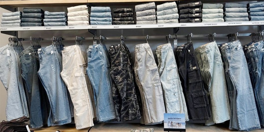pacsun jeans stacked and hanging in store 