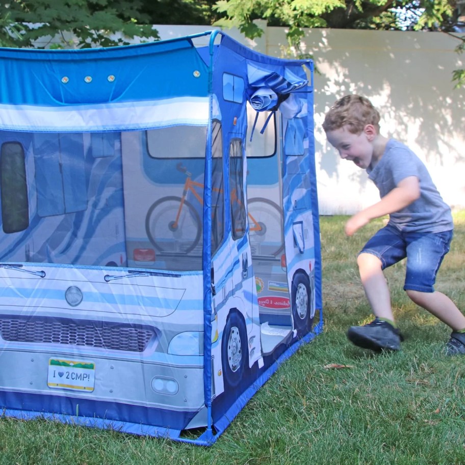 kid running into Melissa Doug Camper Tent on grass