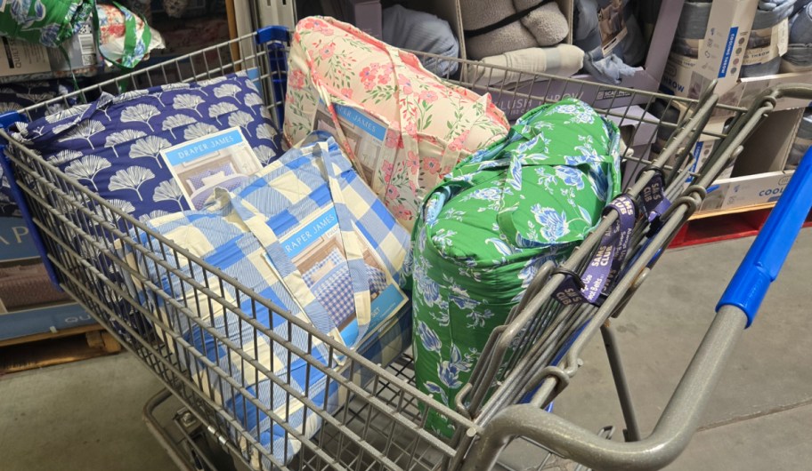 Sams club draper and james bedding in different patterns inside of shopping cart