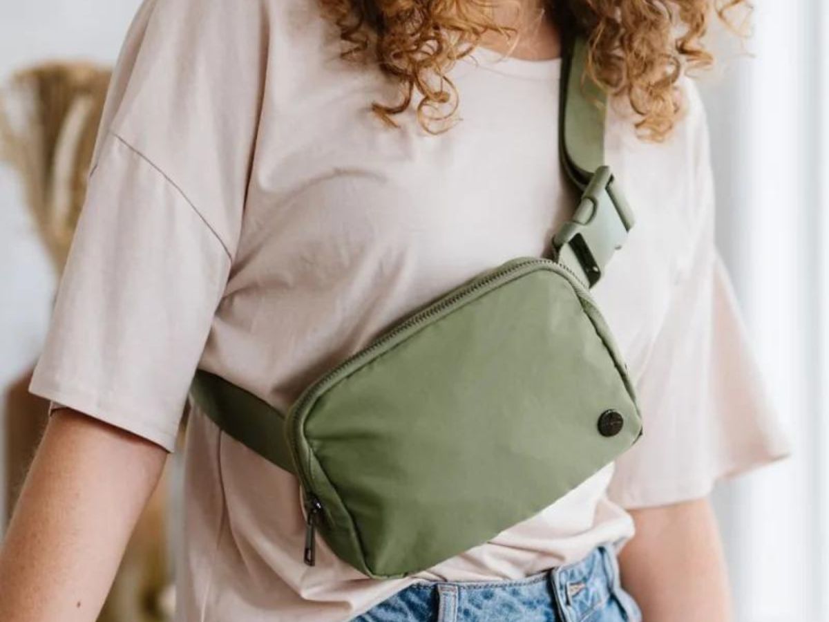 person wearing green belt bag