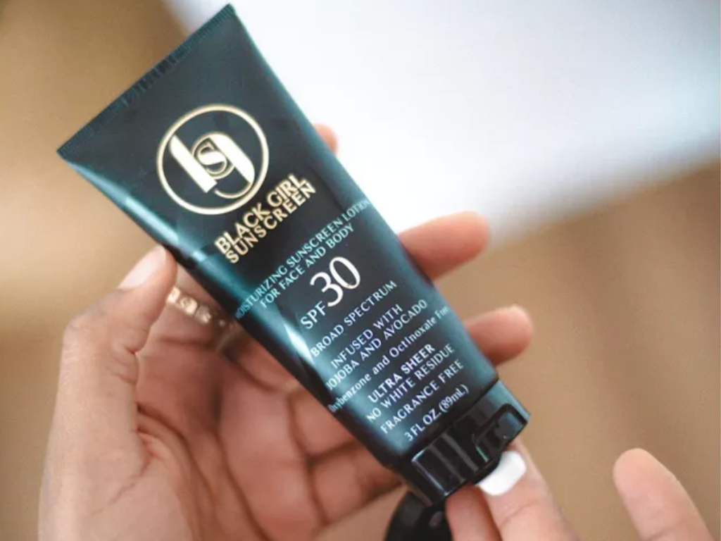 person using Black Girl Sunscreen Broad Spectrum