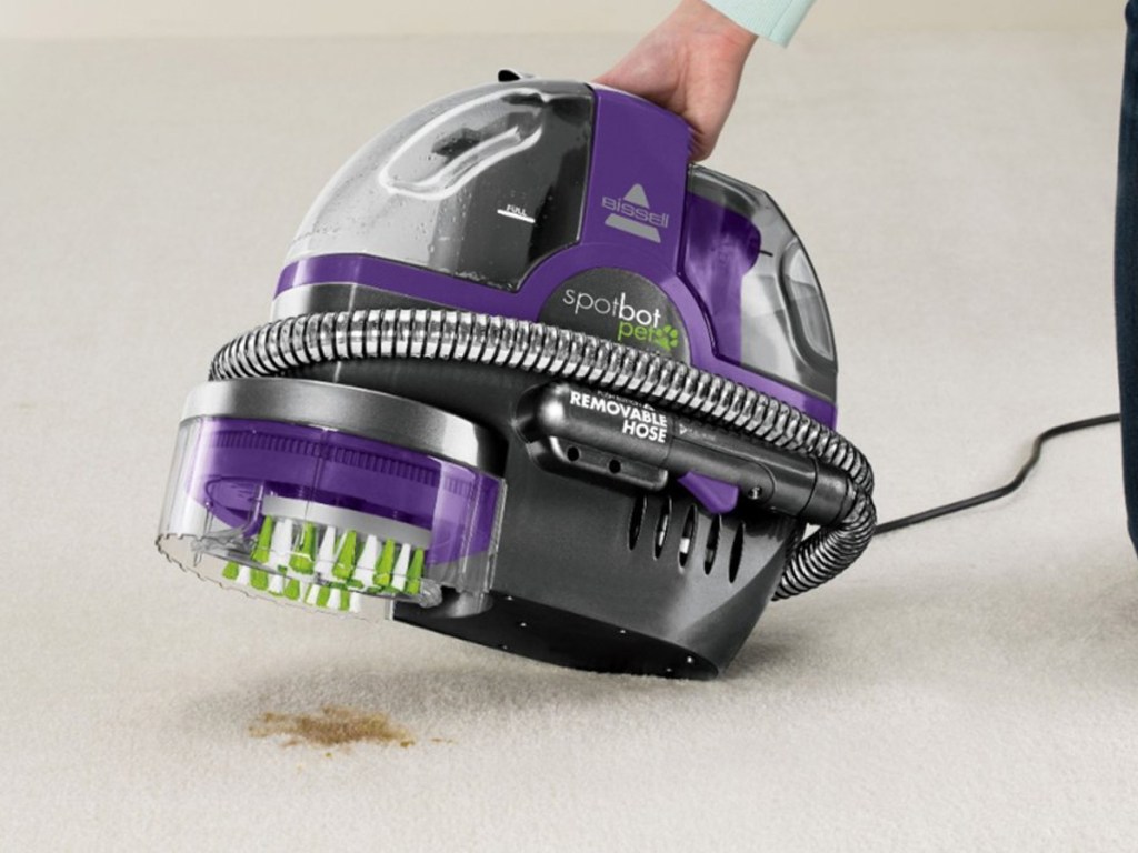 placing bissell spotbot onto stain on carpet