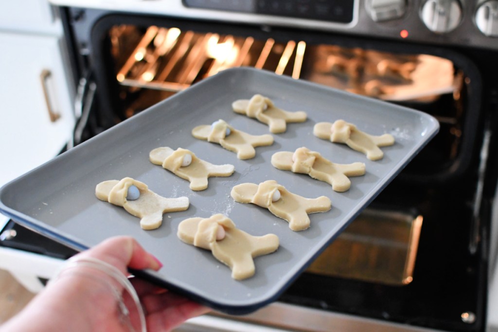 easter bunny cookies on a caraway sheet pan going into the oven