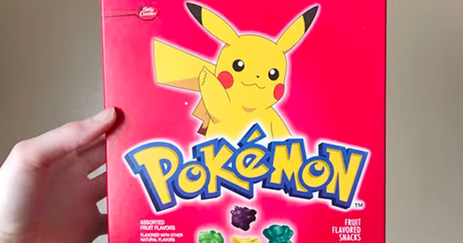 hand holding a red box of Pokemon Fruit Snacks