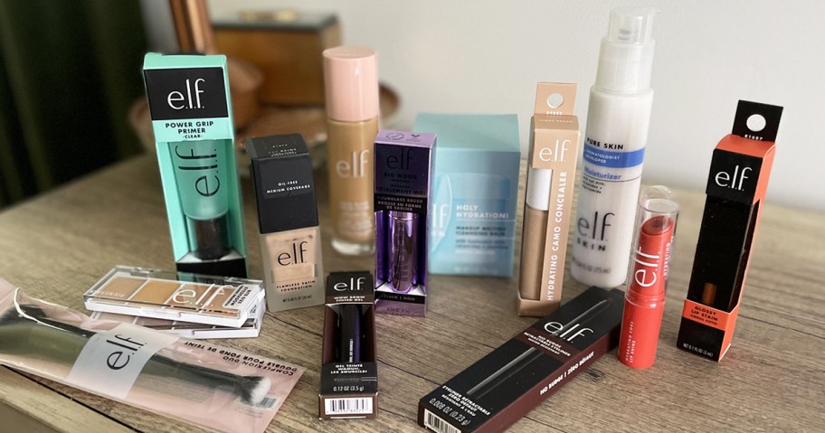 various elf cosmetics products on wood table