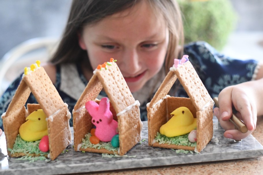 young girl with her diy peep house for Easter