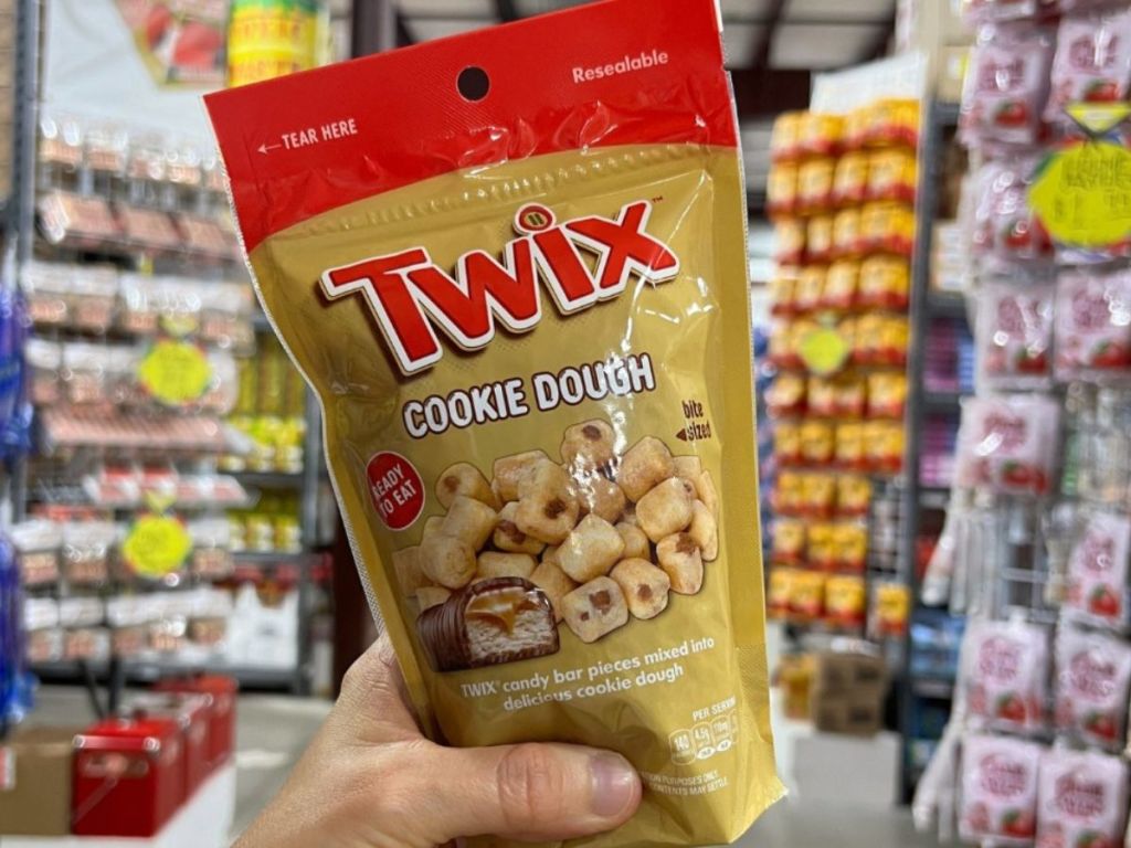 Hand holding a bag of Twix Cookie Dough Bites