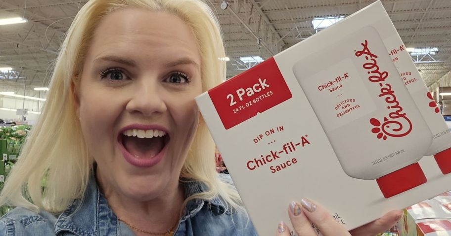 A smiling lady with a Chick Fil A Sauce 2-Pack
