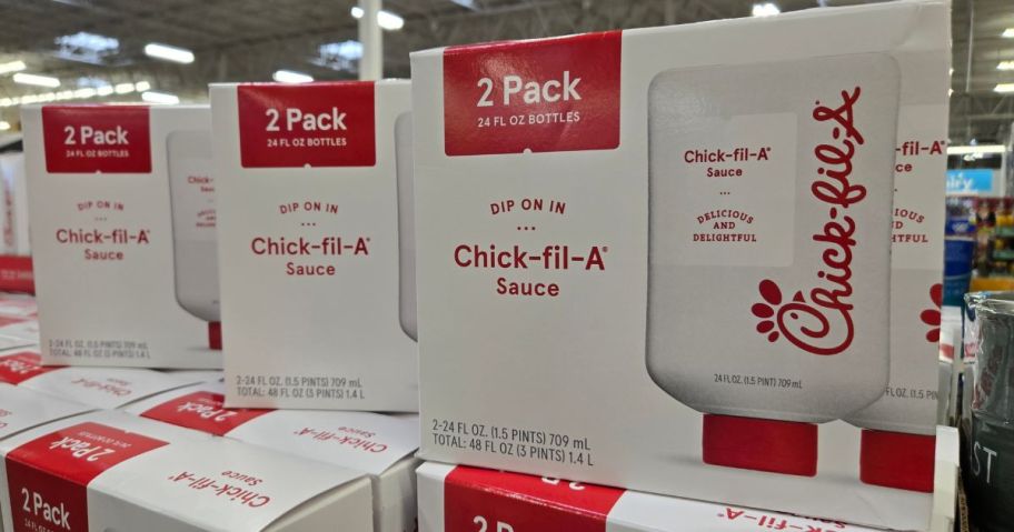 Several boxes of chick-fil-A sauce bottles in a store