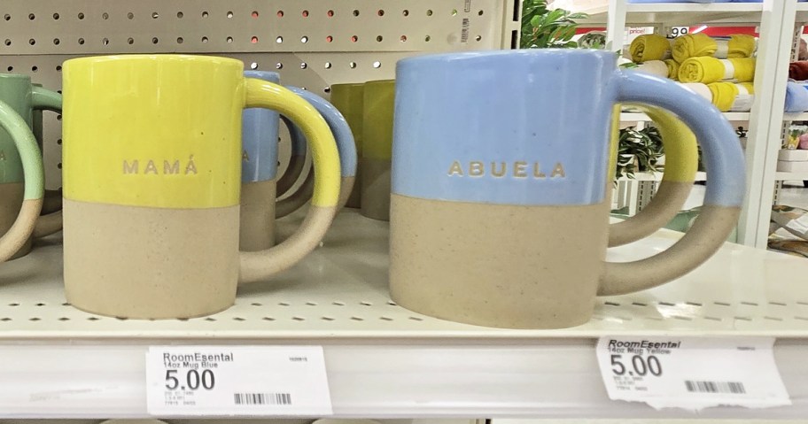 yellow and blue dipped clay mugs that say mama and abuela