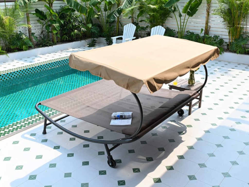 hammock bed outside by pool on tile patio