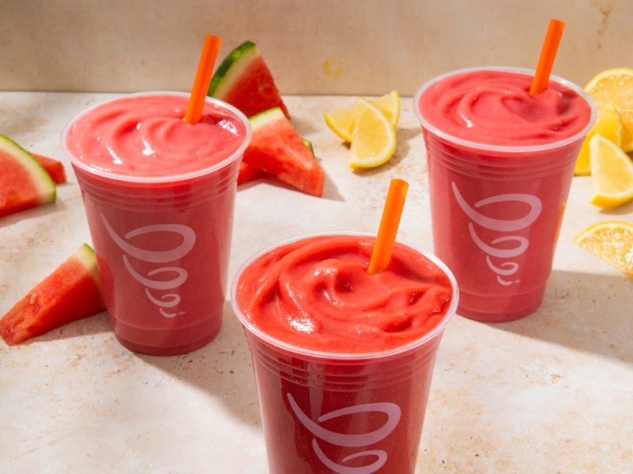 three red smoothies in to-go cups