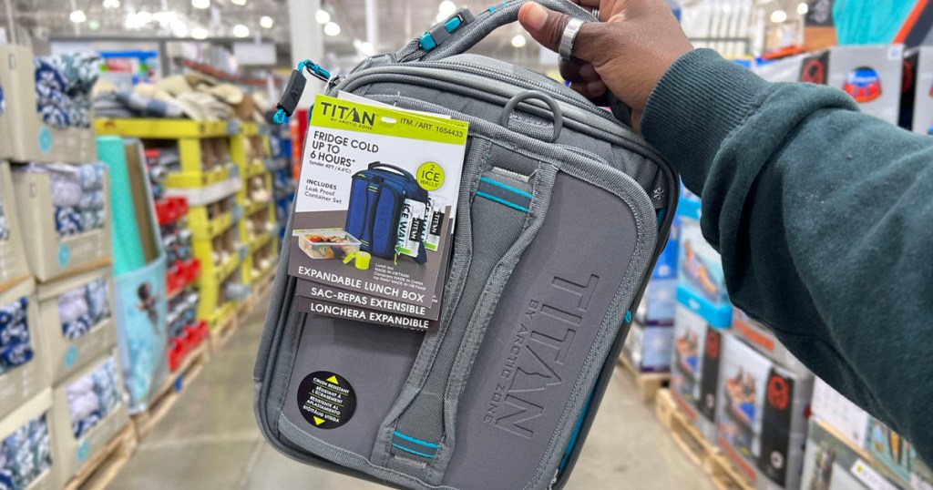 hand holding gray titan lunchbox