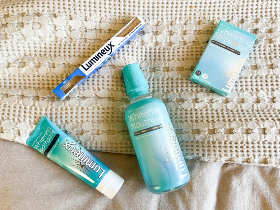 Lumineux Whitening Toothpaste, Whitening Mouthwash, Whitening Strips, and a toothbrush