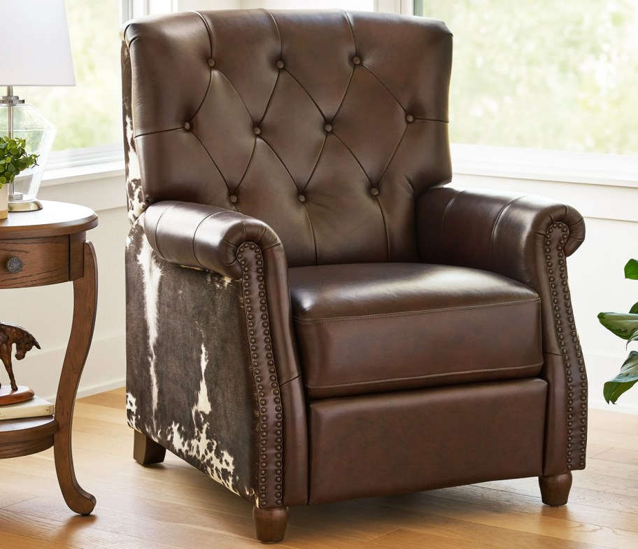 brown leather recliner with cow hide sides