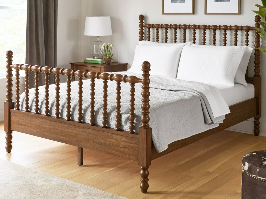 brown wood spindle bed frame in bedroom