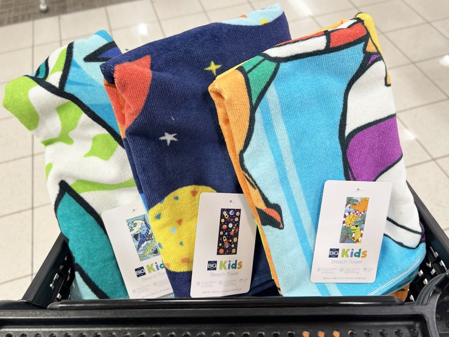 three kids beach towels in black shopping cart