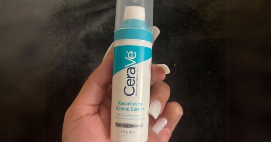 hand holding a bottle of CeraVe Resurfacing Retinol Serum
