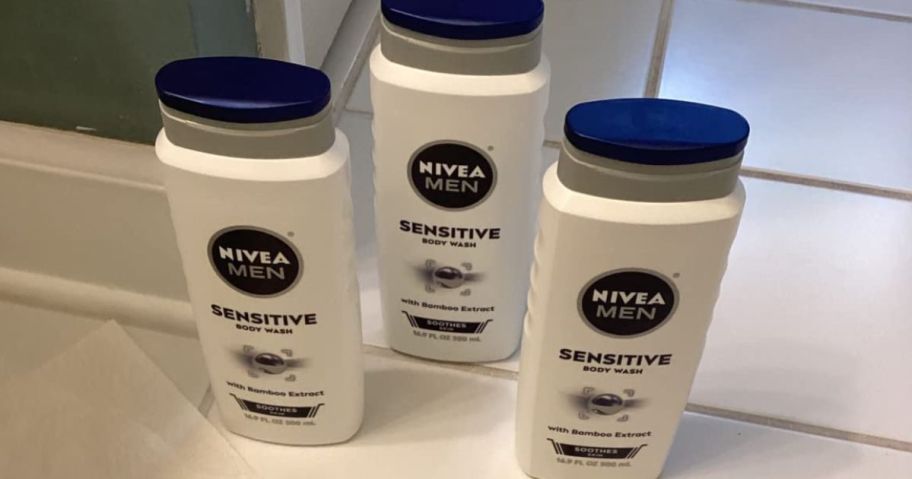 3 bottles of Nivea Men's sensitive body wash on the floor