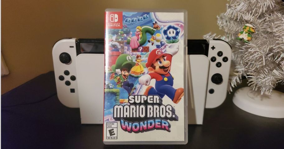Super Mario Bros Wonder Game for Nintendo Switch sitting against nintendo switch platform
