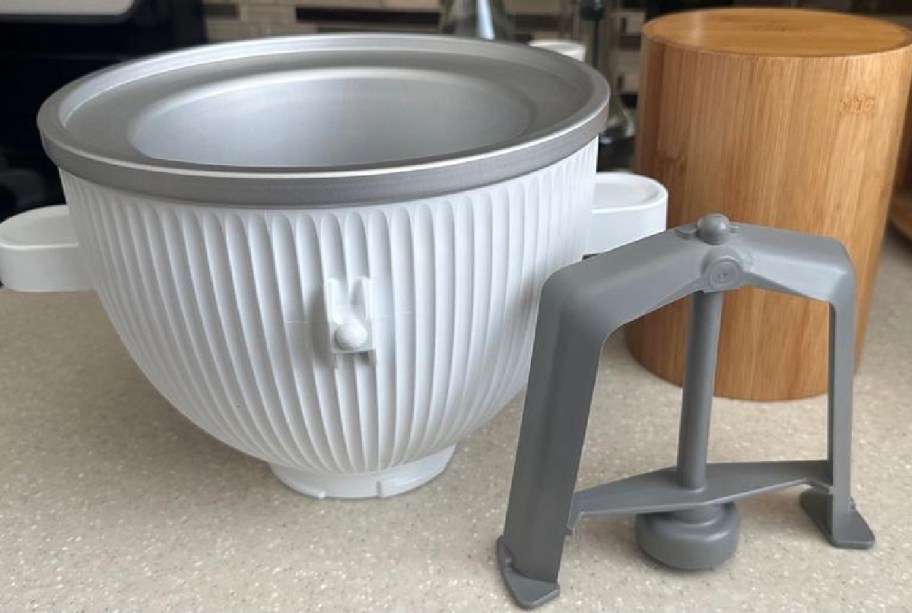 kitchenaid ice cream bowl with extra bits next to it on the table