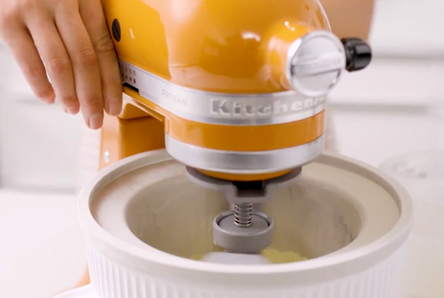 yellow kitchenaid mixer with ice cream bowl and attachement 