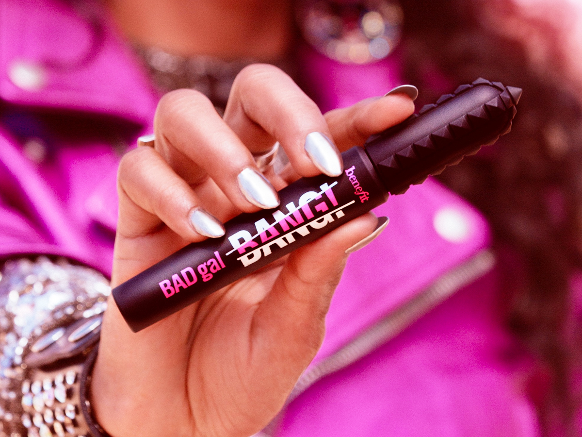 woman holding up a tube of Benefit Cosmetics BADgal BANG! Mascara