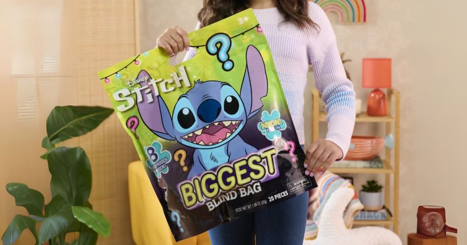 girl holding Disney Stitch Biggest Blind Bag