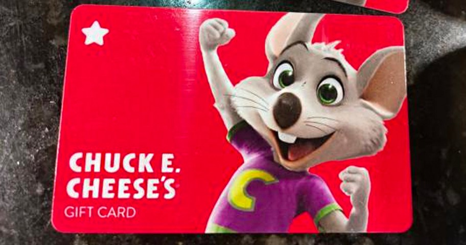 chuck e cheese gift card on table