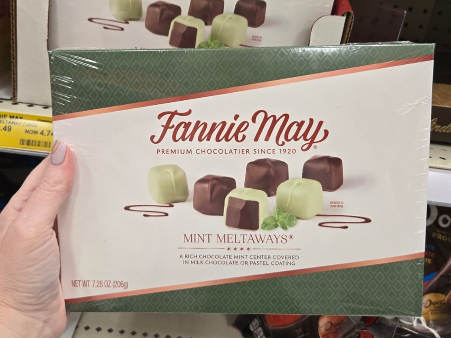 hand holding fannie may chocolate box