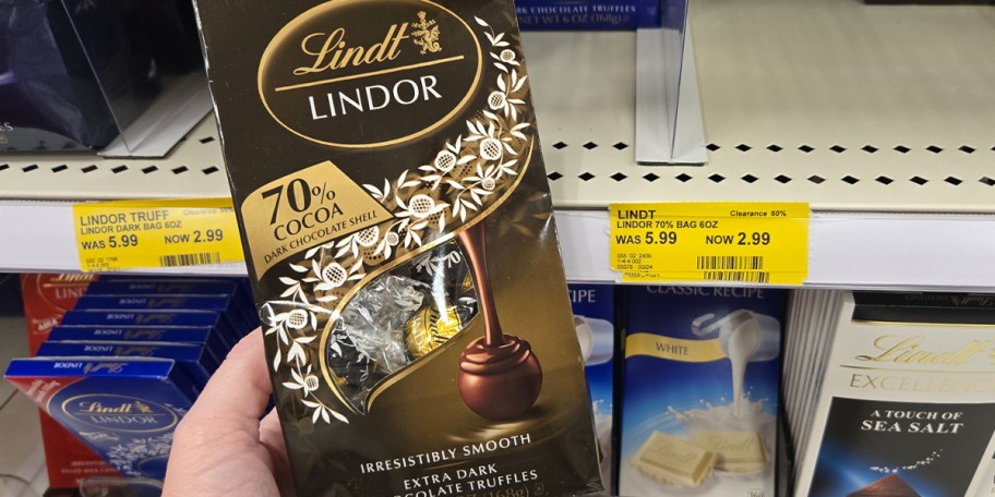 hand holding bag of lindt truffles 