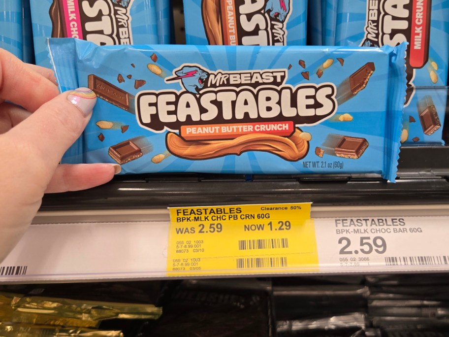 hand holding mr beast chocolate bar 