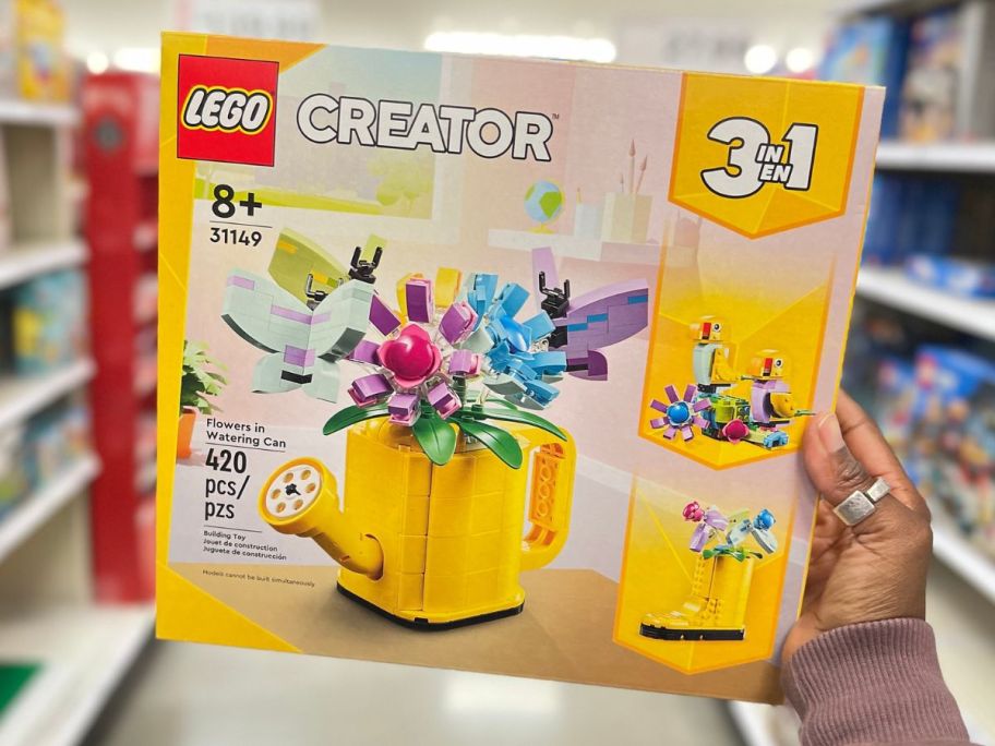 hand holding lego watering can set 