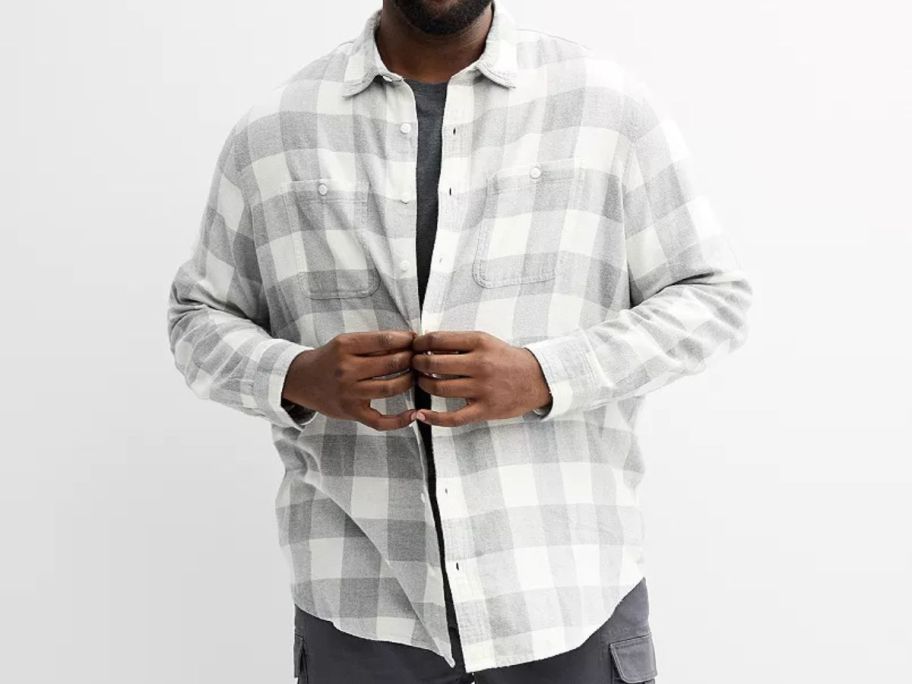 A man wearing a flannel shirt
