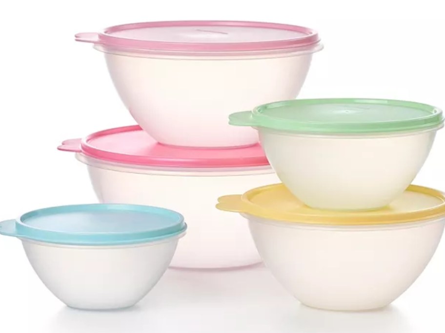 a set of clear round Tupperware bowl with multicolor lids