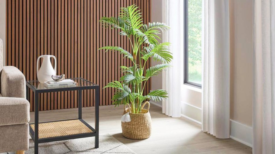 green faux palm tree in basket in living room