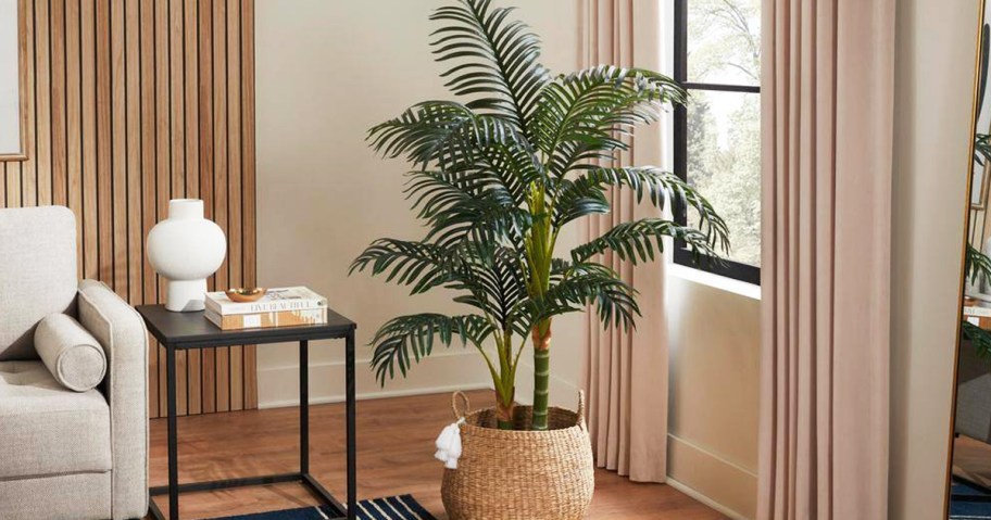 green faux palm tree in basket in living room